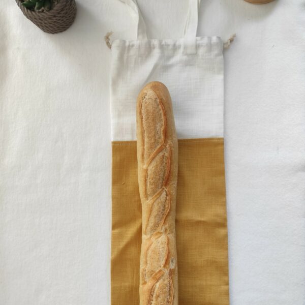 sac à pain bicolore jaune avec une baguette