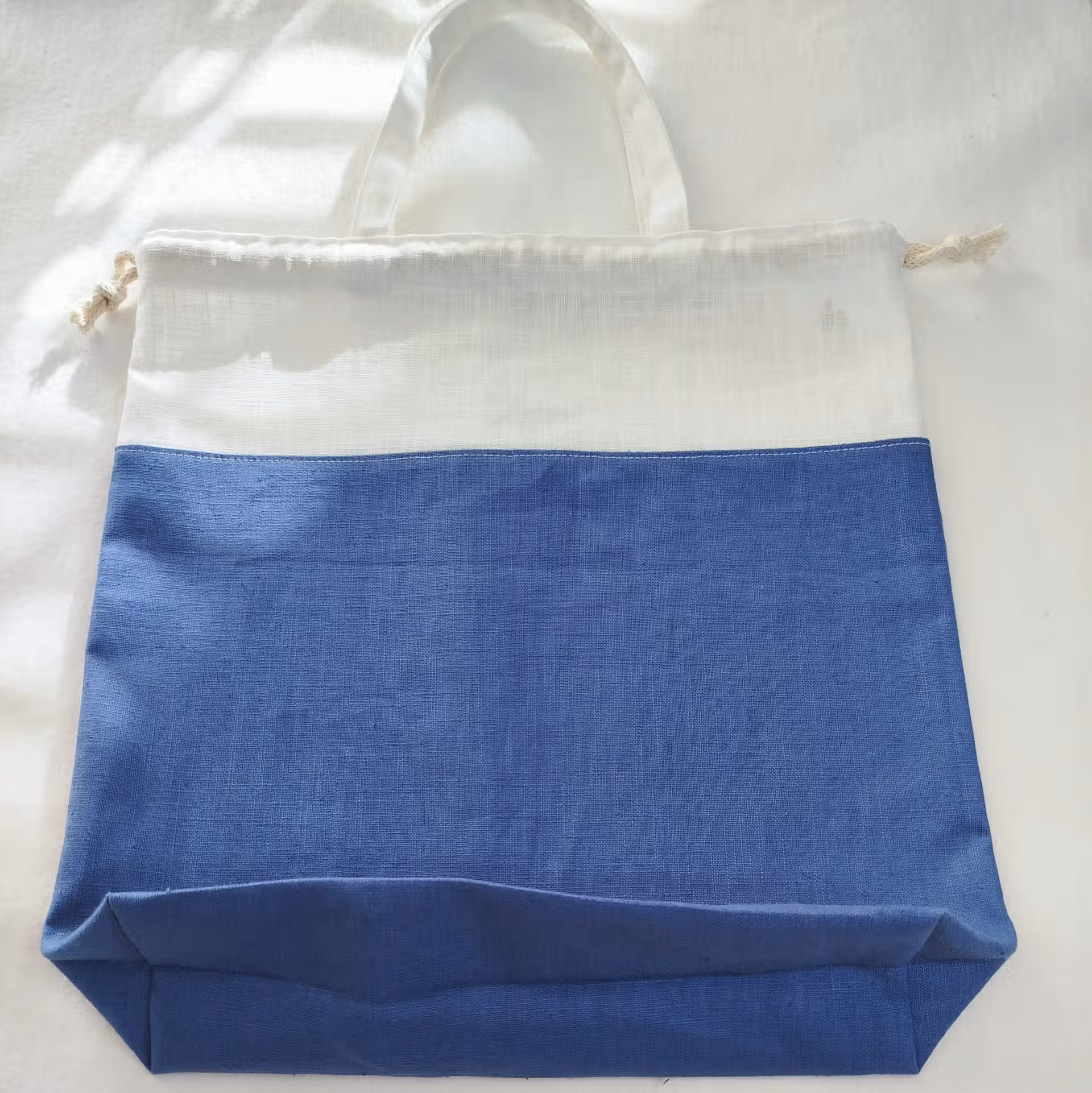 sac à pain rond bicolore bleu et écru