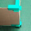 Guide d'angles pour la fabrication de boîte en carton